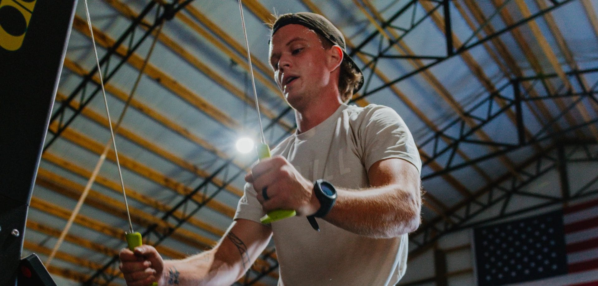 Athlete using SkiErg machine for a high-intensity cardio workout at Wotown Fit